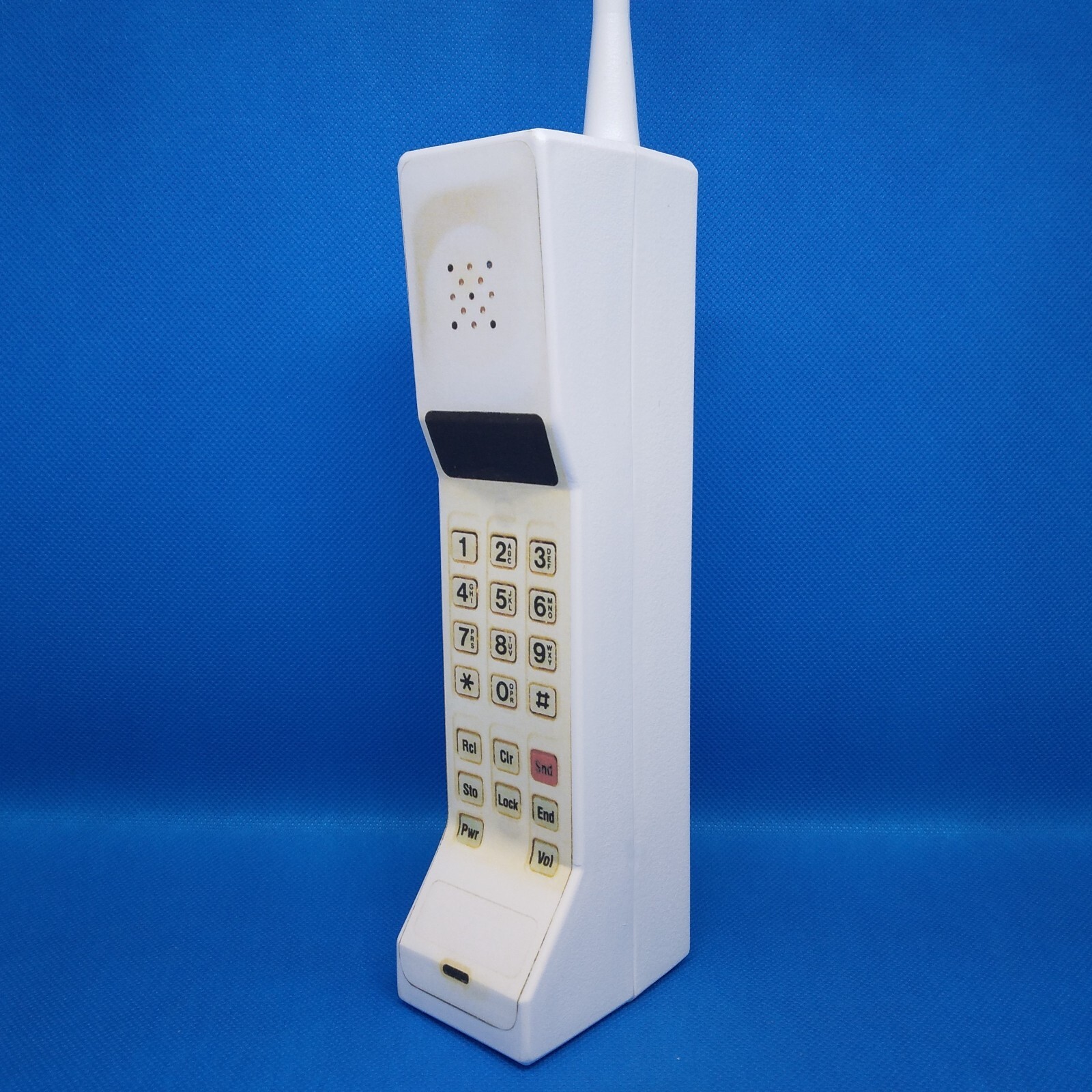 Handmade Scream Brick Phone Prop in White. The front is a sticker/label